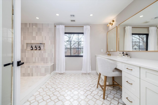 64 Jane Ct, Westbury, NY 11590 - full bathroom featuring recessed lighting, plenty of natural light, vanity, and visible vents