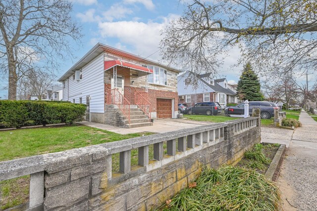 97 Arlington Ave, Valley Stream, NY 11580 - view of front of property featuring an attached garage and concrete driveway