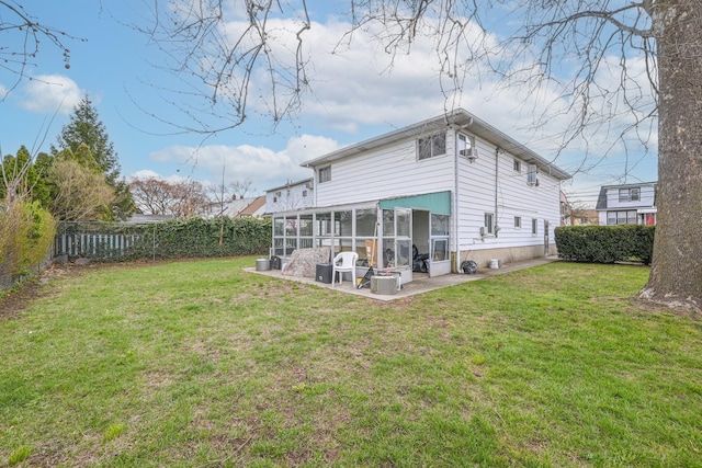 97 Arlington Ave, Valley Stream, NY 11580 - rear view of property with a fenced backyard, a patio, a sunroom, and a lawn