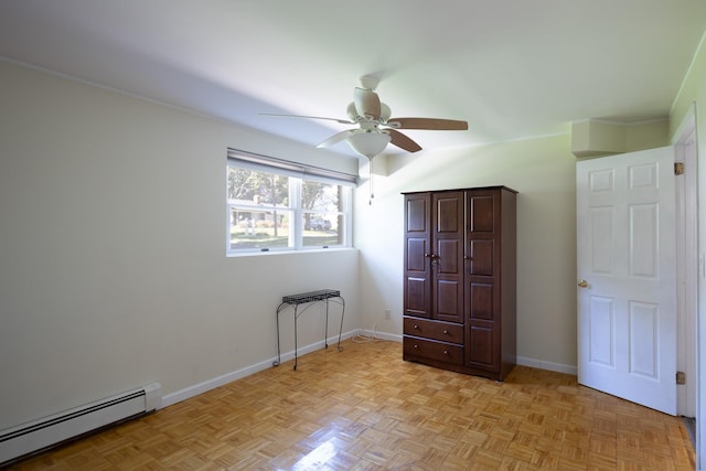 bedroom featuring baseboards, a ceiling fan, and baseboard heating
