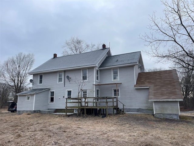 156 Greenville Tpke, Middletown, NY 10940 - rear view of house with a shingled roof, a wooden deck, and a chimney