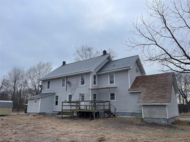 156 Greenville Tpke, Middletown, NY 10940 - back of house featuring a shingled roof, a wooden deck, and a chimney