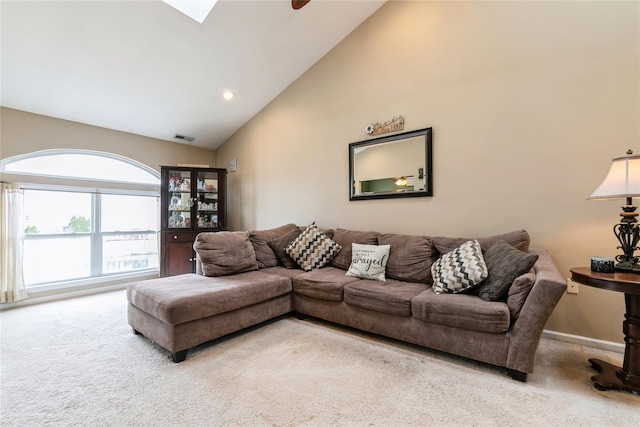 carpeted living room with baseboards, visible vents, high vaulted ceiling, and recessed lighting