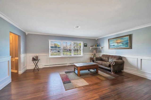 living area featuring wood finished floors, visible vents, ornamental molding, a decorative wall, and wainscoting