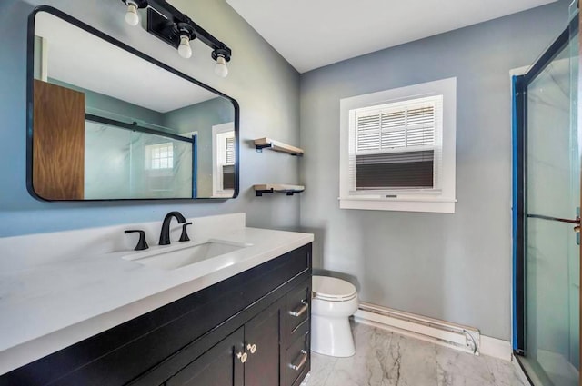 bathroom with baseboard heating, vanity, a shower stall, and a healthy amount of sunlight