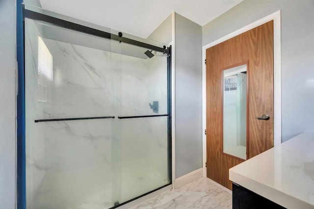 bathroom featuring a marble finish shower and marble finish floor