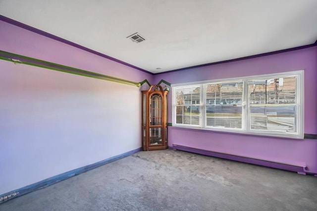 carpeted empty room with ornamental molding, baseboards, visible vents, and a baseboard radiator