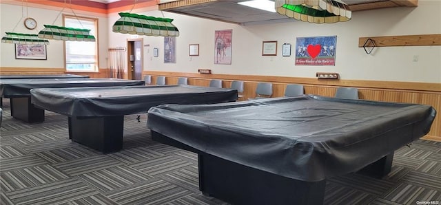recreation room featuring carpet flooring, billiards, and a wainscoted wall