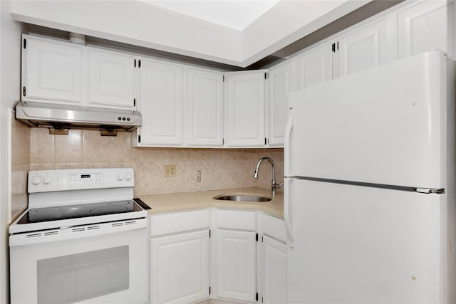 41-23 76th St # 2B, Elmhurst, NY 11373 - kitchen with white appliances, under cabinet range hood, white cabinetry, light countertops, and tasteful backsplash