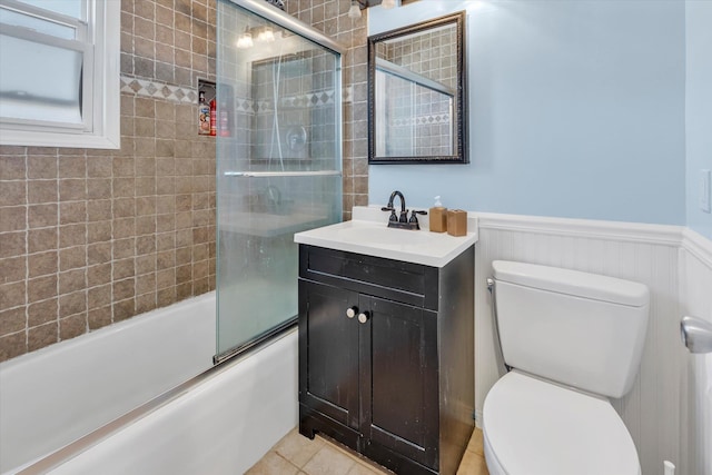 4410 Wilshire Ln Unit 4410, Oakdale, NY 11769 - bathroom featuring toilet, wainscoting, enclosed tub / shower combo, vanity, and tile patterned floors