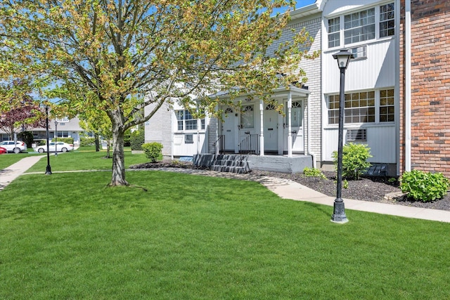 4410 Wilshire Ln Unit 4410, Oakdale, NY 11769 - view of front of house with a front lawn and brick siding