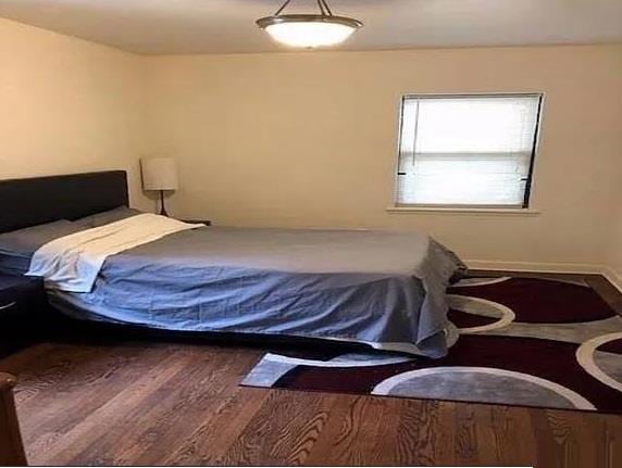 7 Bond St Unit 2C, Great Neck, NY 11021 - bedroom featuring wood finished floors