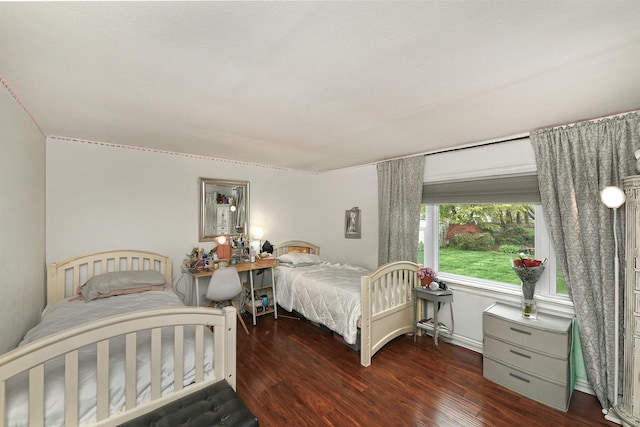 bedroom featuring wood finished floors