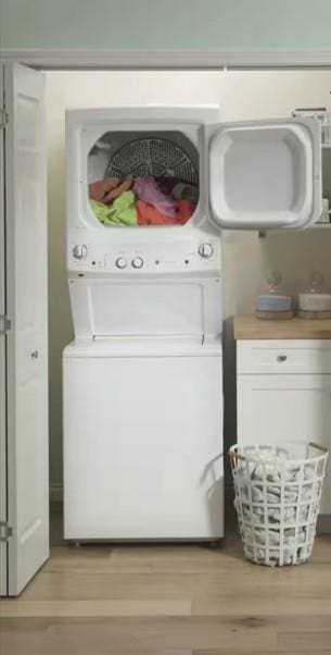 washroom featuring light wood-type flooring and laundry area