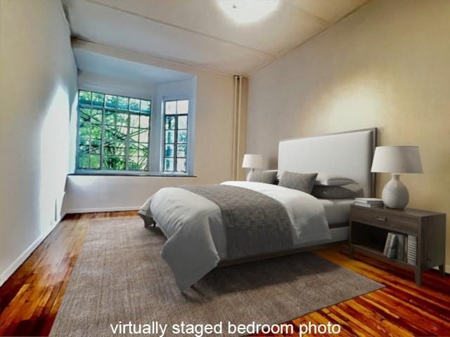 4 Dartmouth St Unit 24, Forest Hills, NY 11375 - bedroom featuring wood finished floors and baseboards
