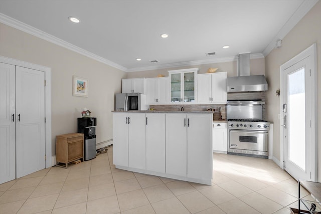 kitchen with wall chimney range hood, crown molding, a center island, glass insert cabinets, and appliances with stainless steel finishes