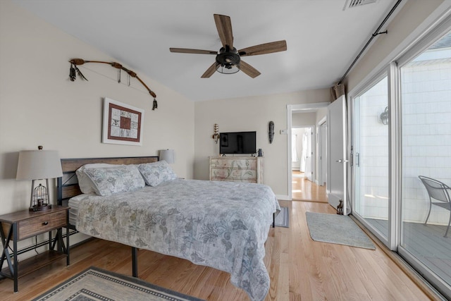 bedroom with light wood-style flooring and visible vents