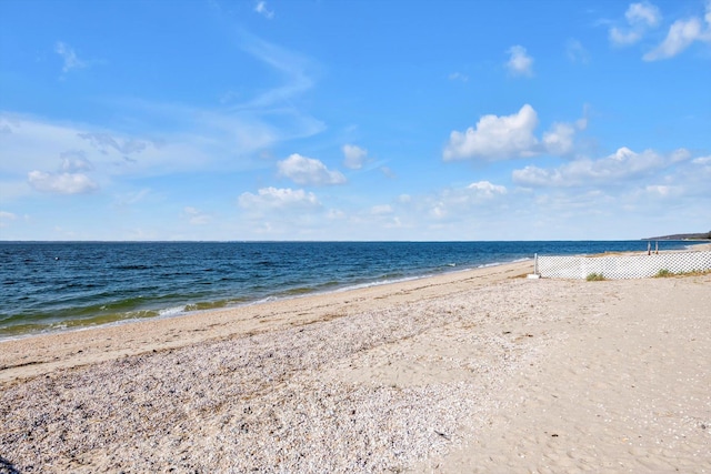 view of water feature with a beach view