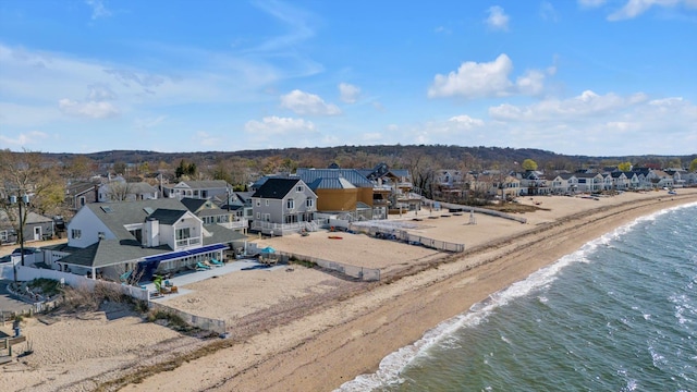 bird's eye view with a beach view, a residential view, and a water view