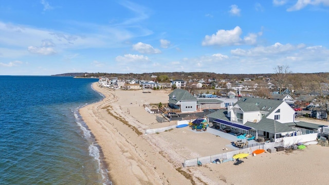 aerial view featuring a beach view, a residential view, and a water view