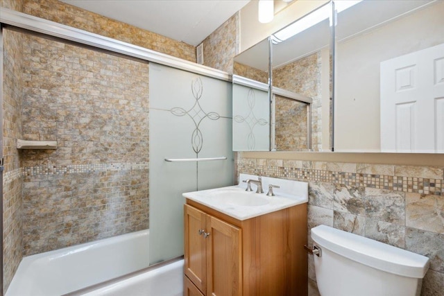 150 Overlook Ave Unit 8V, Peekskill, NY 10566 - full bathroom with toilet, shower / bath combination with glass door, vanity, and tile walls