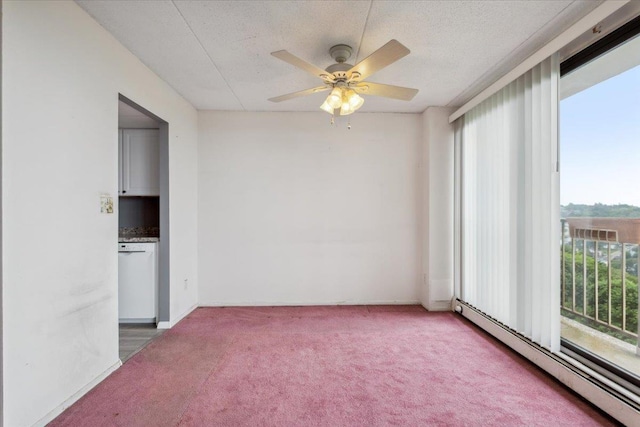 150 Overlook Ave Unit 8V, Peekskill, NY 10566 - empty room featuring baseboard heating, carpet, a ceiling fan, and a textured ceiling