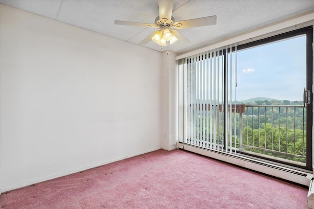 150 Overlook Ave Unit 8V, Peekskill, NY 10566 - spare room featuring a baseboard heating unit, carpet flooring, and a ceiling fan