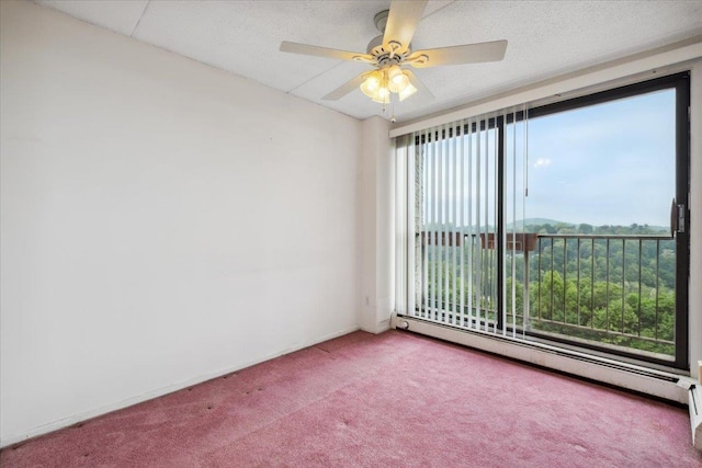 150 Overlook Ave Unit 8V, Peekskill, NY 10566 - carpeted spare room featuring a baseboard radiator and a ceiling fan