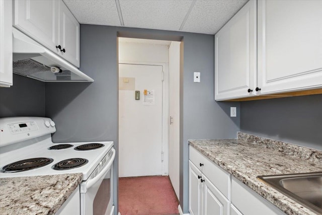 150 Overlook Ave Unit 8V, Peekskill, NY 10566 - kitchen featuring white range with electric cooktop, light colored carpet, a drop ceiling, white cabinetry, and under cabinet range hood