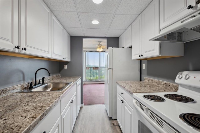 150 Overlook Ave Unit 8V, Peekskill, NY 10566 - kitchen with white appliances, a sink, under cabinet range hood, white cabinets, and a drop ceiling