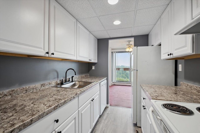 150 Overlook Ave Unit 8V, Peekskill, NY 10566 - kitchen featuring white dishwasher, a sink, white cabinets, light wood finished floors, and a drop ceiling