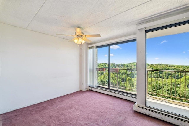 150 Overlook Ave Unit 8V, Peekskill, NY 10566 - carpeted empty room with baseboard heating, ceiling fan, and a textured ceiling