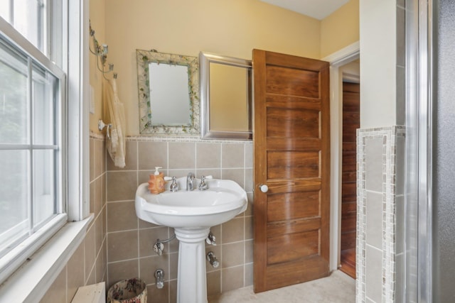bathroom with tile walls