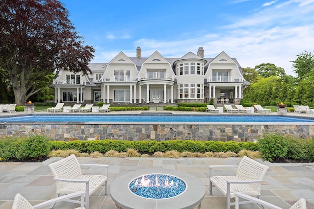 25 Brewster Ln, East Setauket, NY 11733 - swimming pool featuring a patio area