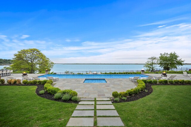 25 Brewster Ln, East Setauket, NY 11733 - outdoor pool featuring a patio, a yard, and a water view