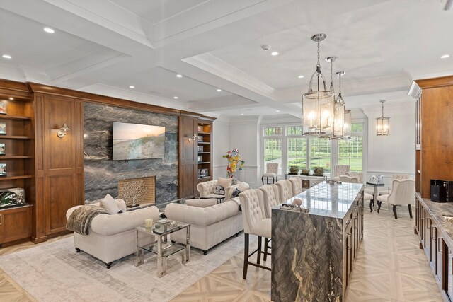 25 Brewster Ln, East Setauket, NY 11733 - living area featuring a chandelier, ornamental molding, recessed lighting, wainscoting, and coffered ceiling