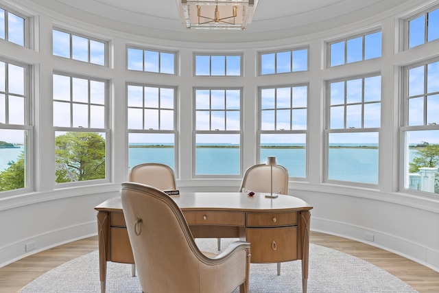 25 Brewster Ln, East Setauket, NY 11733 - office with a water view, baseboards, and light wood-style flooring