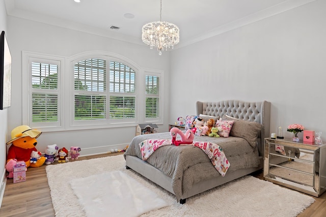 25 Brewster Ln, East Setauket, NY 11733 - bedroom featuring wood finished floors, a chandelier, ornamental molding, and baseboards