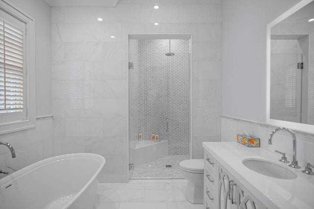 25 Brewster Ln, East Setauket, NY 11733 - full bath featuring tile walls, marble finish floors, a freestanding bath, vanity, and a stall shower