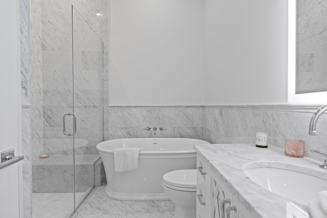 25 Brewster Ln, East Setauket, NY 11733 - full bathroom featuring a freestanding bath, vanity, a shower stall, toilet, and a wainscoted wall