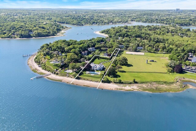 25 Brewster Ln, East Setauket, NY 11733 - aerial view of property's location featuring property boundaries highlighted, a large body of water, and a heavily wooded area