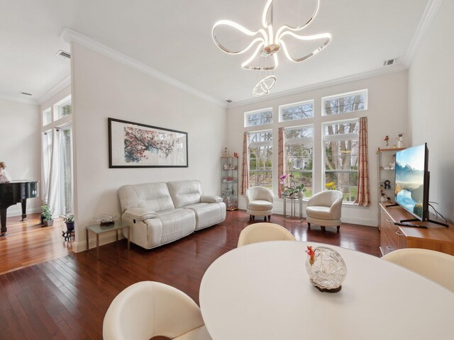 5 Hamlet Woods Dr, Saint James, NY 11780 - living area with visible vents, ornamental molding, a notable chandelier, and hardwood / wood-style flooring
