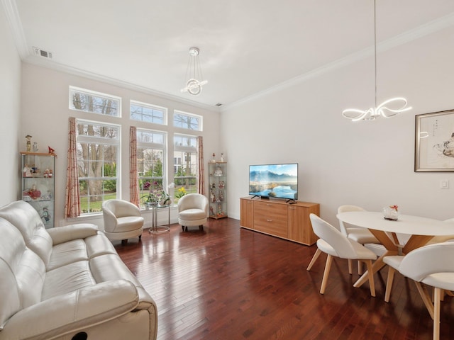 5 Hamlet Woods Dr, Saint James, NY 11780 - living area with dark wood-style flooring, an inviting chandelier, ornamental molding, visible vents, and a healthy amount of sunlight