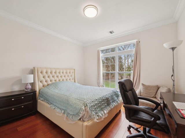 5 Hamlet Woods Dr, Saint James, NY 11780 - bedroom featuring dark wood finished floors, ornamental molding, and visible vents