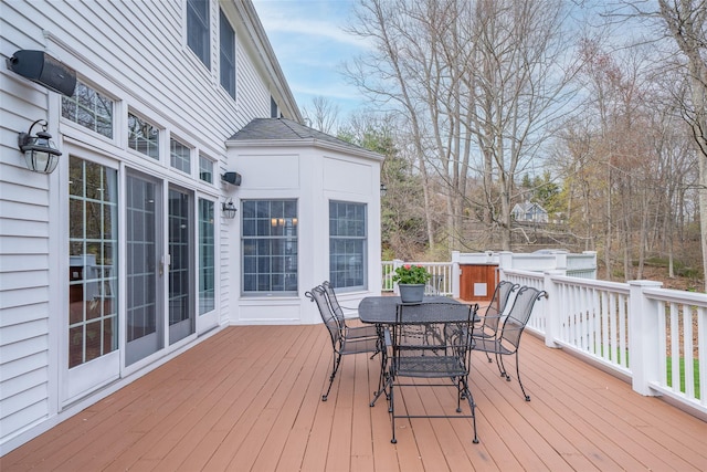 wooden terrace with outdoor dining area