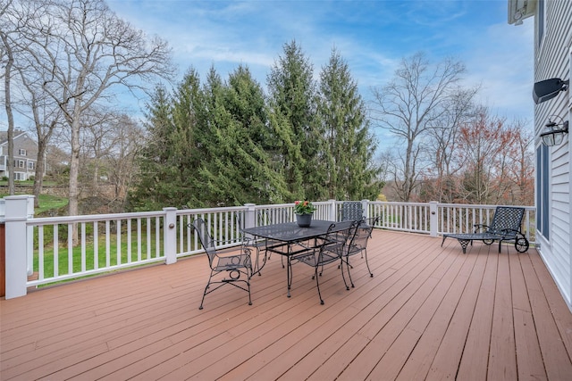 wooden deck with outdoor dining area