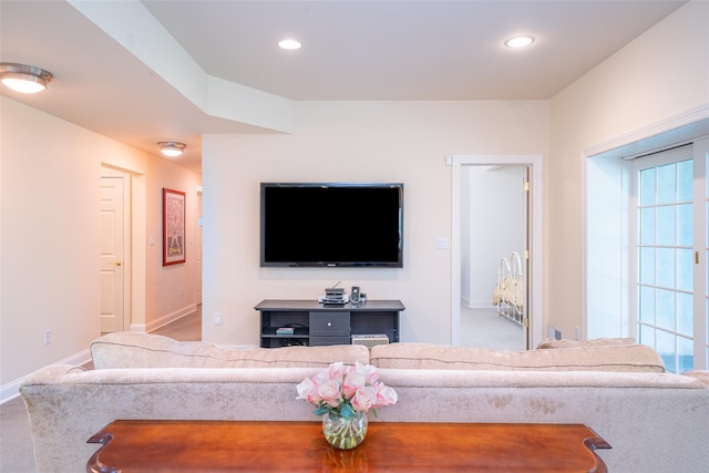 living room with baseboards, recessed lighting, and carpet flooring