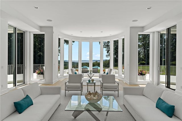 sunken living room featuring recessed lighting