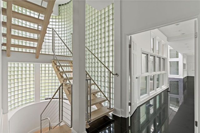 stairs featuring tile patterned flooring