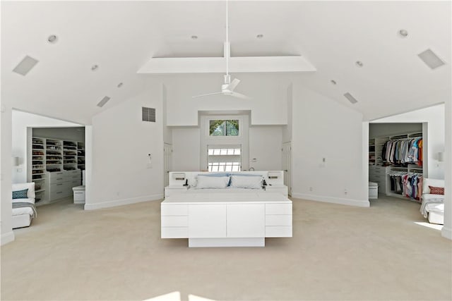 living room featuring high vaulted ceiling, light carpet, and visible vents
